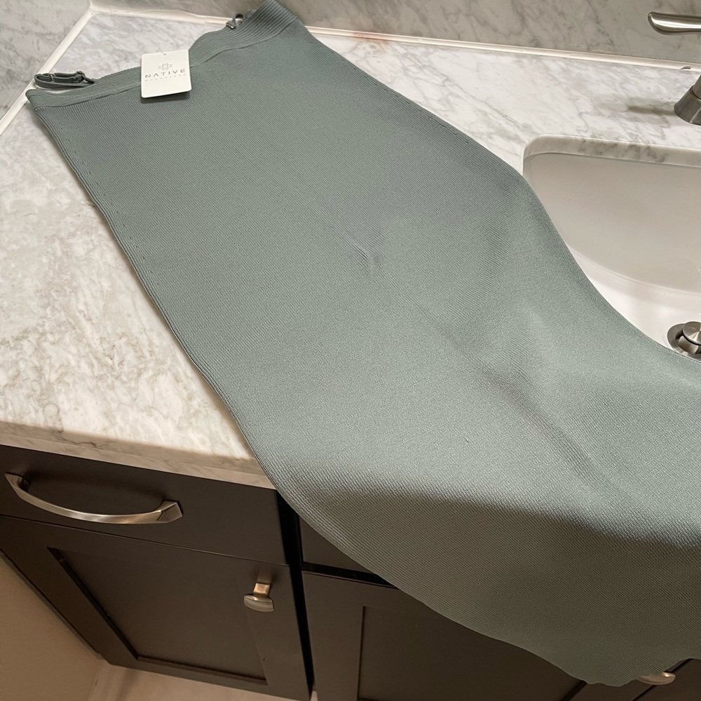 Green pencil skirt with side cut outs